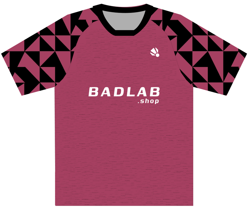 A short-sleeve badlab t-shirt with a heathered dusty rose body, black and white geometric patterned sleeves, and a black collar. The chest features the text 'BADLAB .